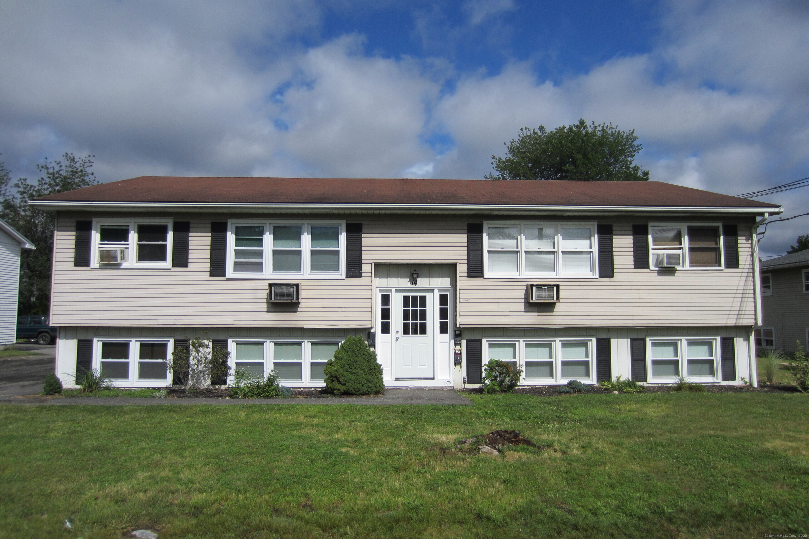 14 Elmview Circle, Unit 3 Waterbury, CT 06708 - Photo 1 of 1 a view of a house with garden and deck