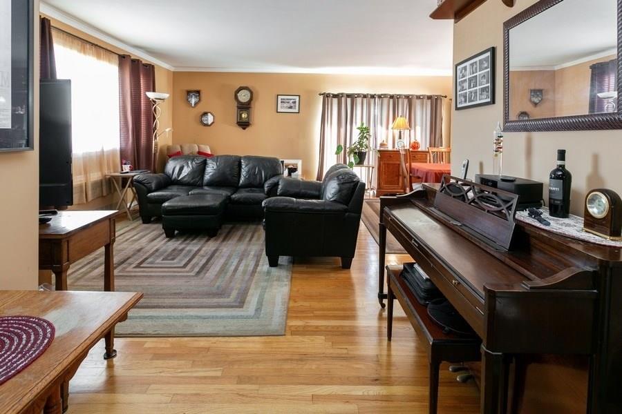 1270 East 98th Street Brooklyn, NY 11236 - Photo 13 of 23 a living room with furniture and a flat screen tv