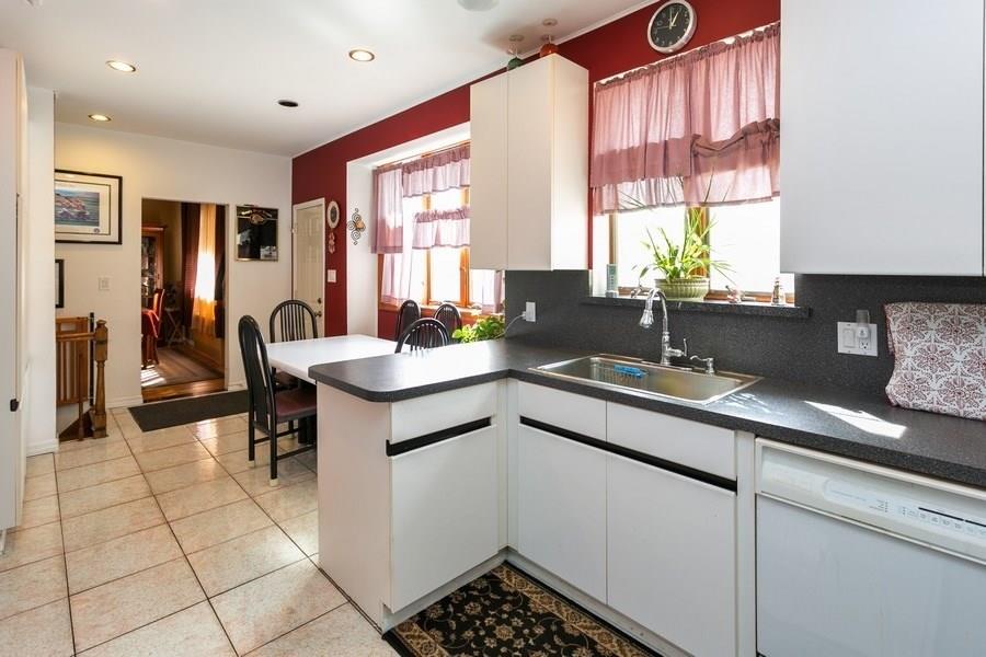 1270 East 98th Street Brooklyn, NY 11236 - Photo 17 of 23 a kitchen with a sink and cabinets