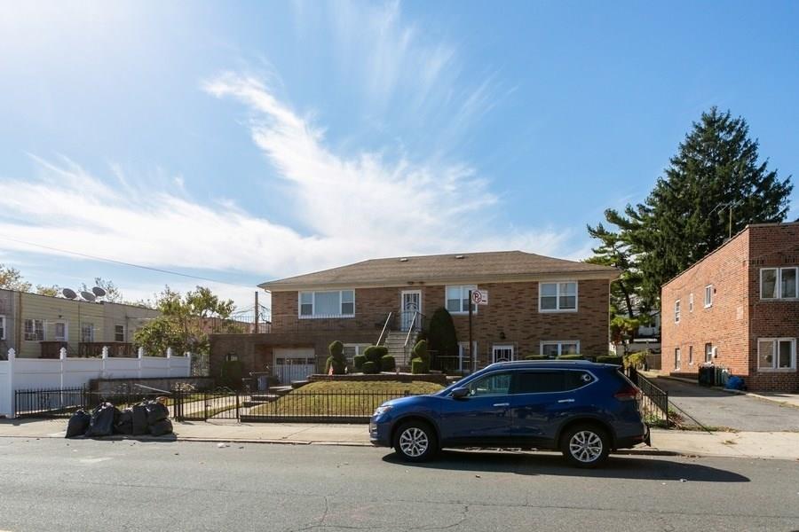 1270 East 98th Street Brooklyn, NY 11236 - Photo 4 of 23 a car parked in front of a house