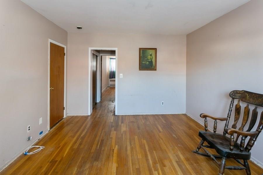 1270 East 98th Street Brooklyn, NY 11236 - Photo 8 of 23 a view of a livingroom with furniture and wooden floor
