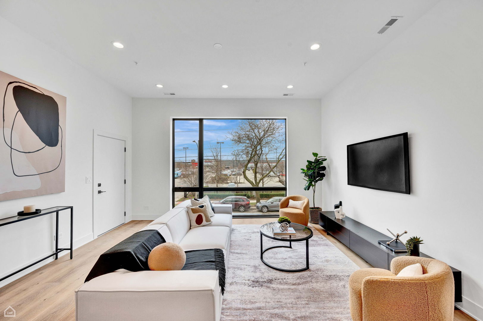 1626 West Hastings Street, Unit 301 Chicago, IL 60608 - Photo 2 of 20 a living room with fireplace furniture and a flat screen tv