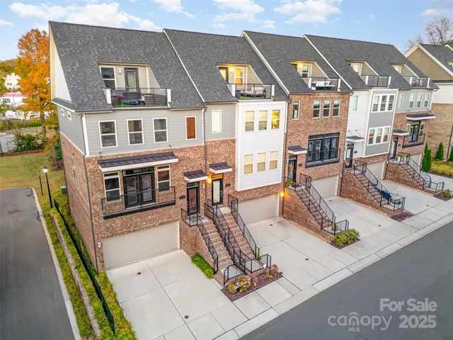 a view of multiple houses with a patio