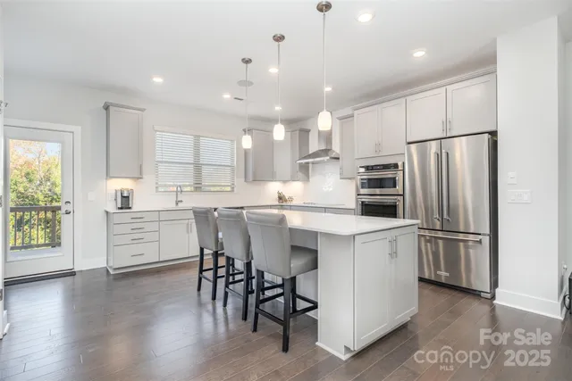 a kitchen with a sink stainless steel appliances and cabinets