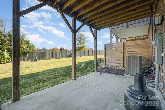 a view of a porch with furniture and garden