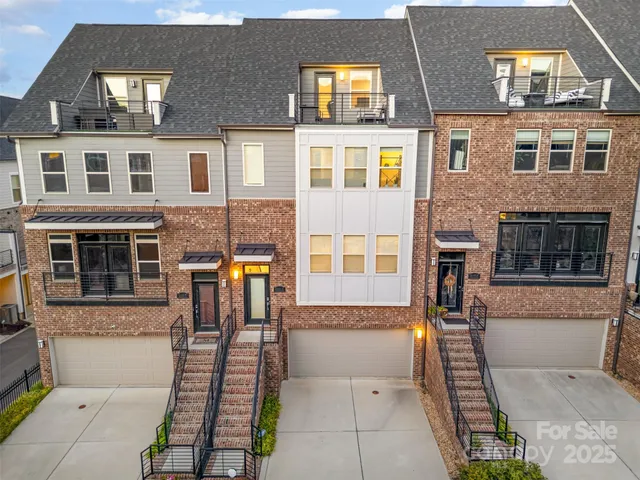 a view of multiple houses with a patio