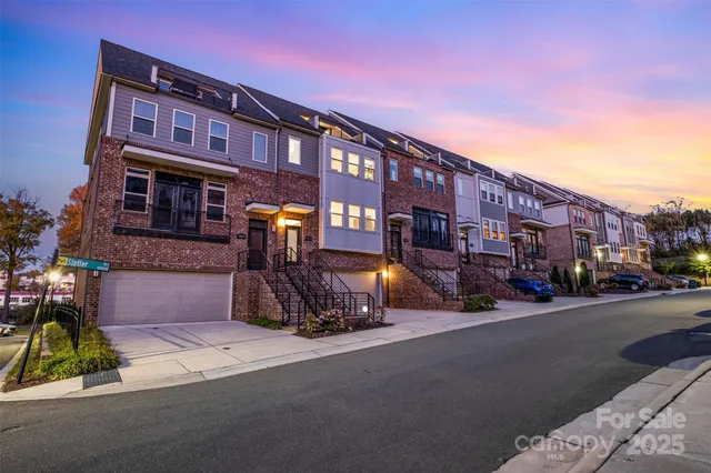 a view of a livingroom with furniture flat screen tv and a ceiling fan
