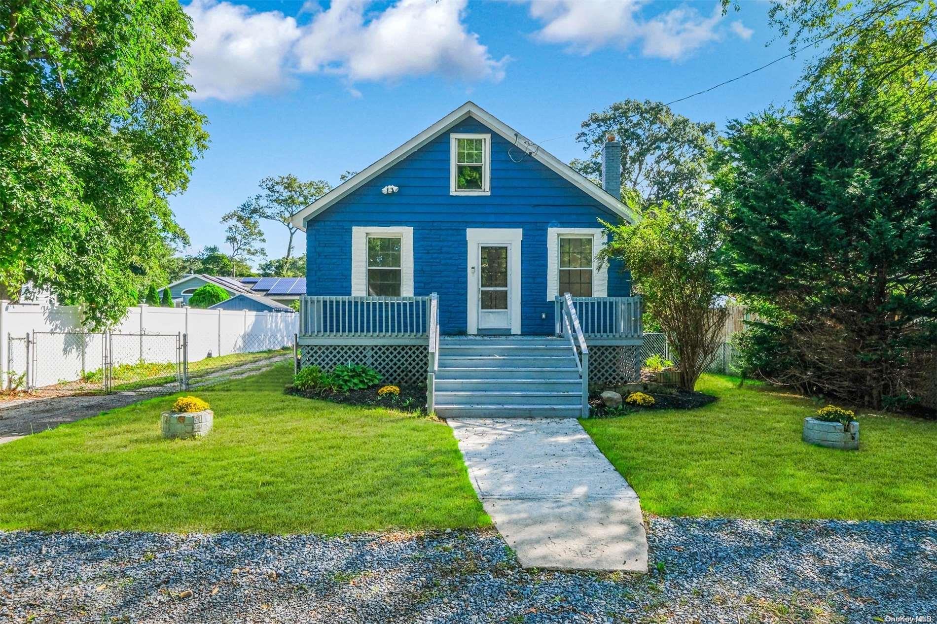 a front view of house with garden