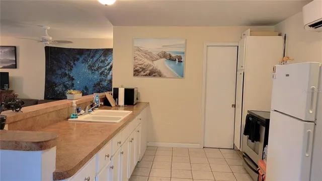 a bathroom with a double vanity sink mirror and shower