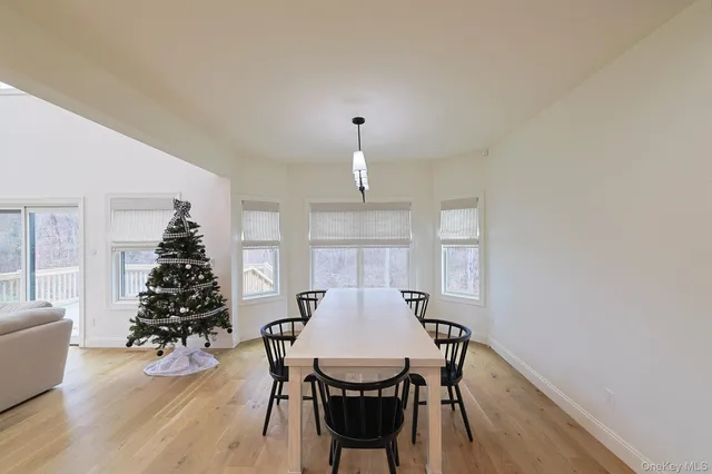 a large kitchen with stainless steel appliances lots of counter space and wooden floor