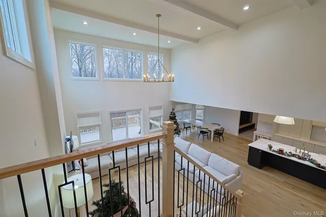 a room with a fan and a wooden floor