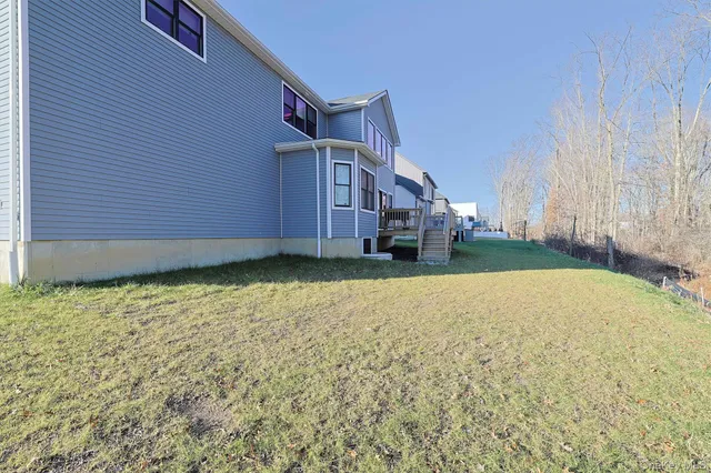 a sitting area with furniture on wooden floor