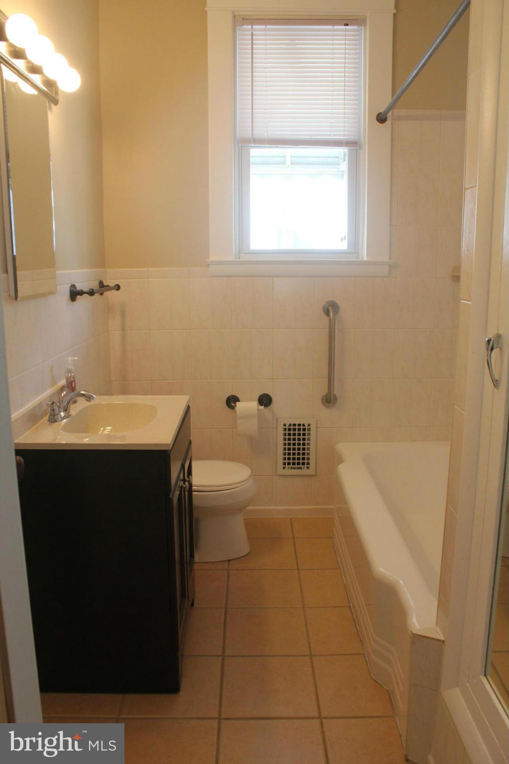 650 North Bend Road Baltimore, MD 21229 - Photo 13 of 22 a bathroom with a sink a toilet and bathtub