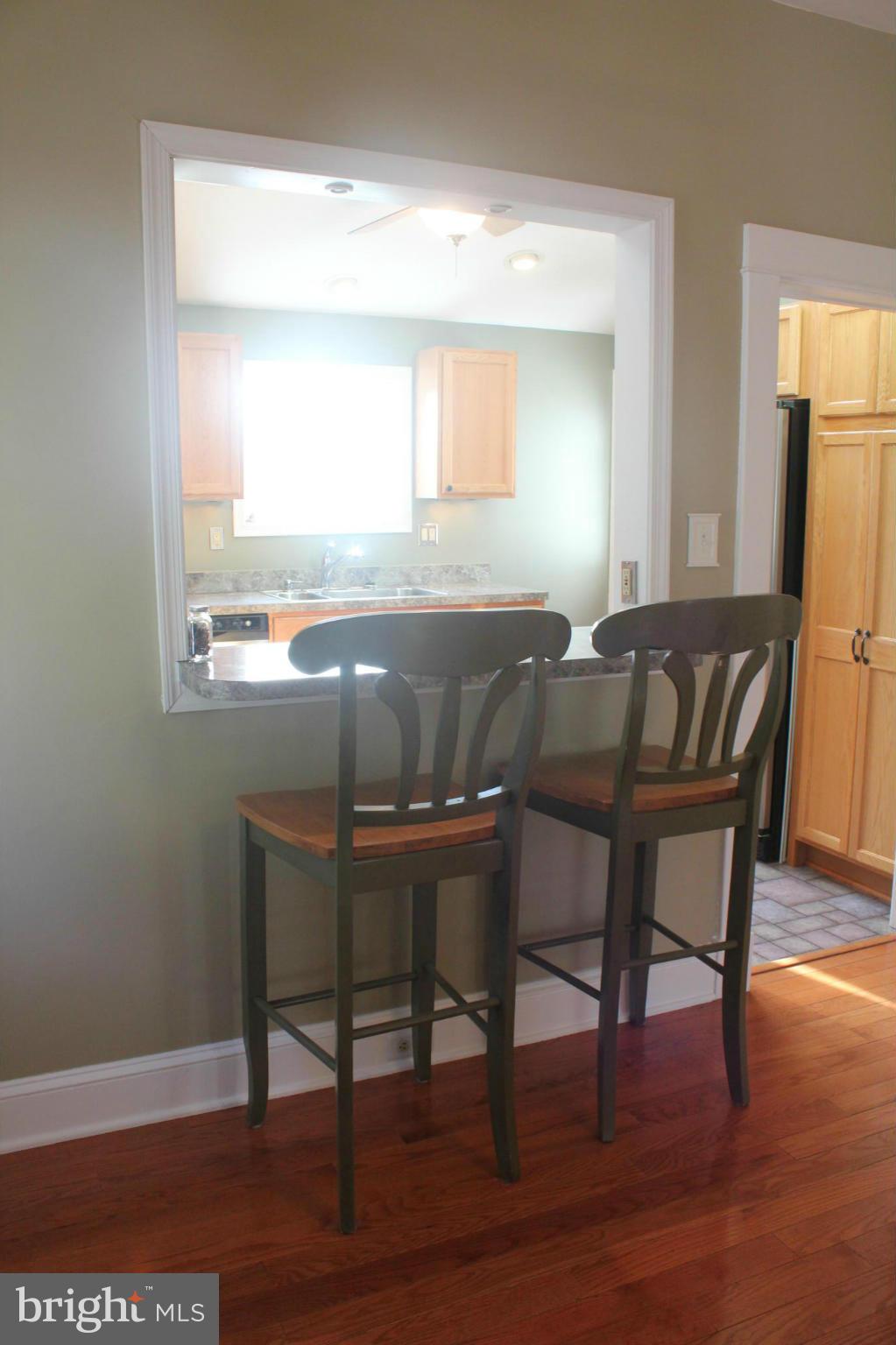 650 North Bend Road Baltimore, MD 21229 - Photo 9 of 22 a view of a dining room with furniture and wooden floor