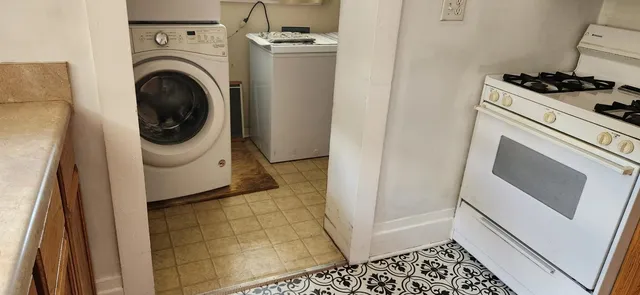 a utility room with dryer and washer