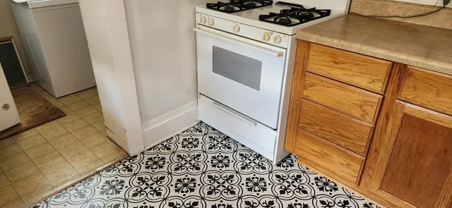a utility room with sink dryer and washer