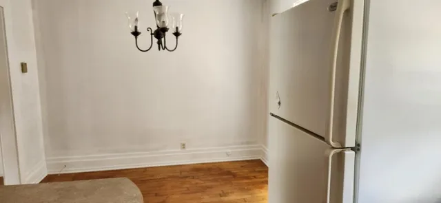 a kitchen with a window sink and refrigerator