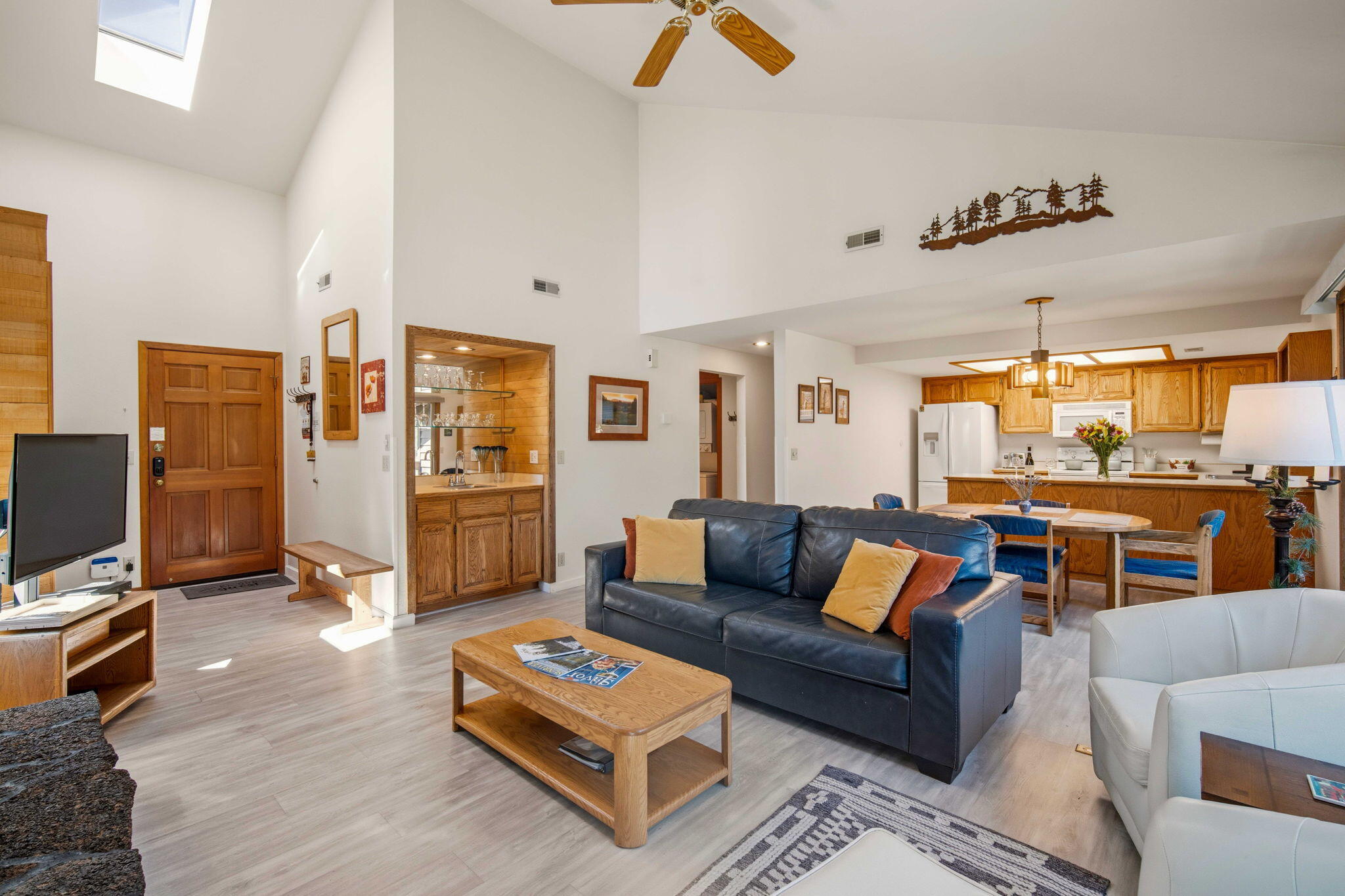 57305 Beaver Ridge Loop, Unit 8 Sunriver, OR 97707 - Photo 5 of 25 a living room with furniture and a flat screen tv