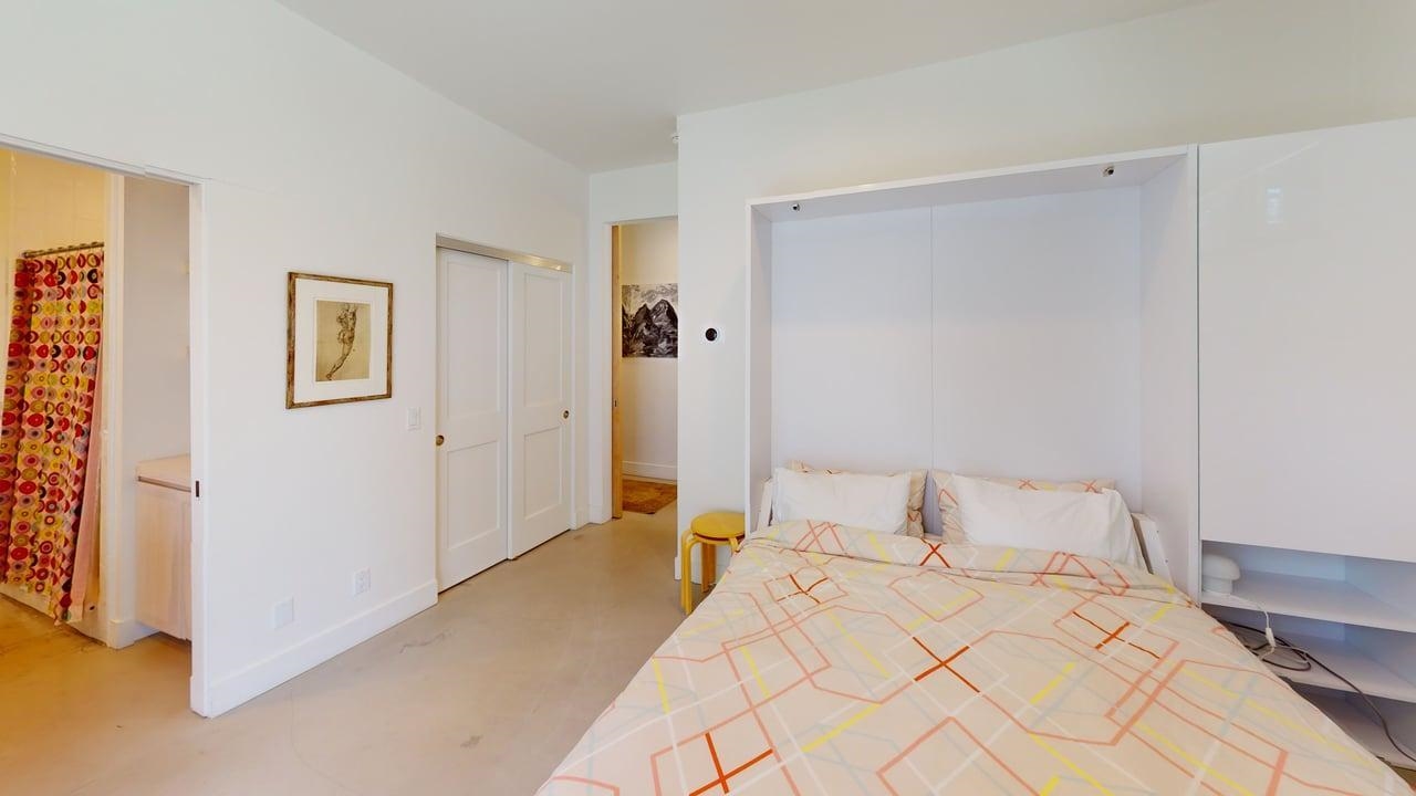 229 Ridgecrest Drive Mammoth Lakes, CA 93546 - Photo 56 of 74 Integrated wall bed with built-in cabinetry, two-panel bifold closet doors, and recessed lighting