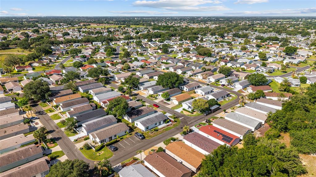 1710 Rosales Road The Villages, FL 32162 - Photo 22 of 23 an aerial view of a city with a mountain