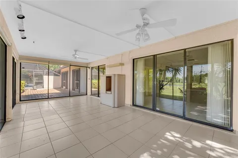 a view of an empty room with glass door