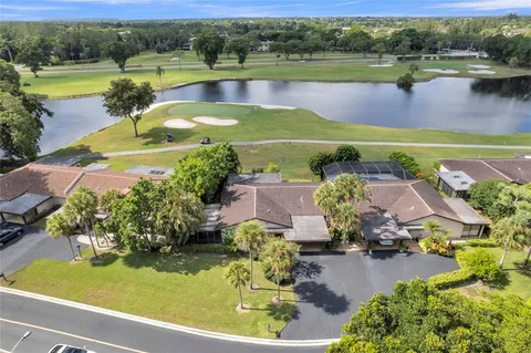 an aerial view of a house with a lake view