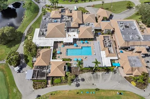 an aerial view of multiple houses with outdoor space