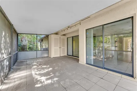 a view of a big room with windows and balcony