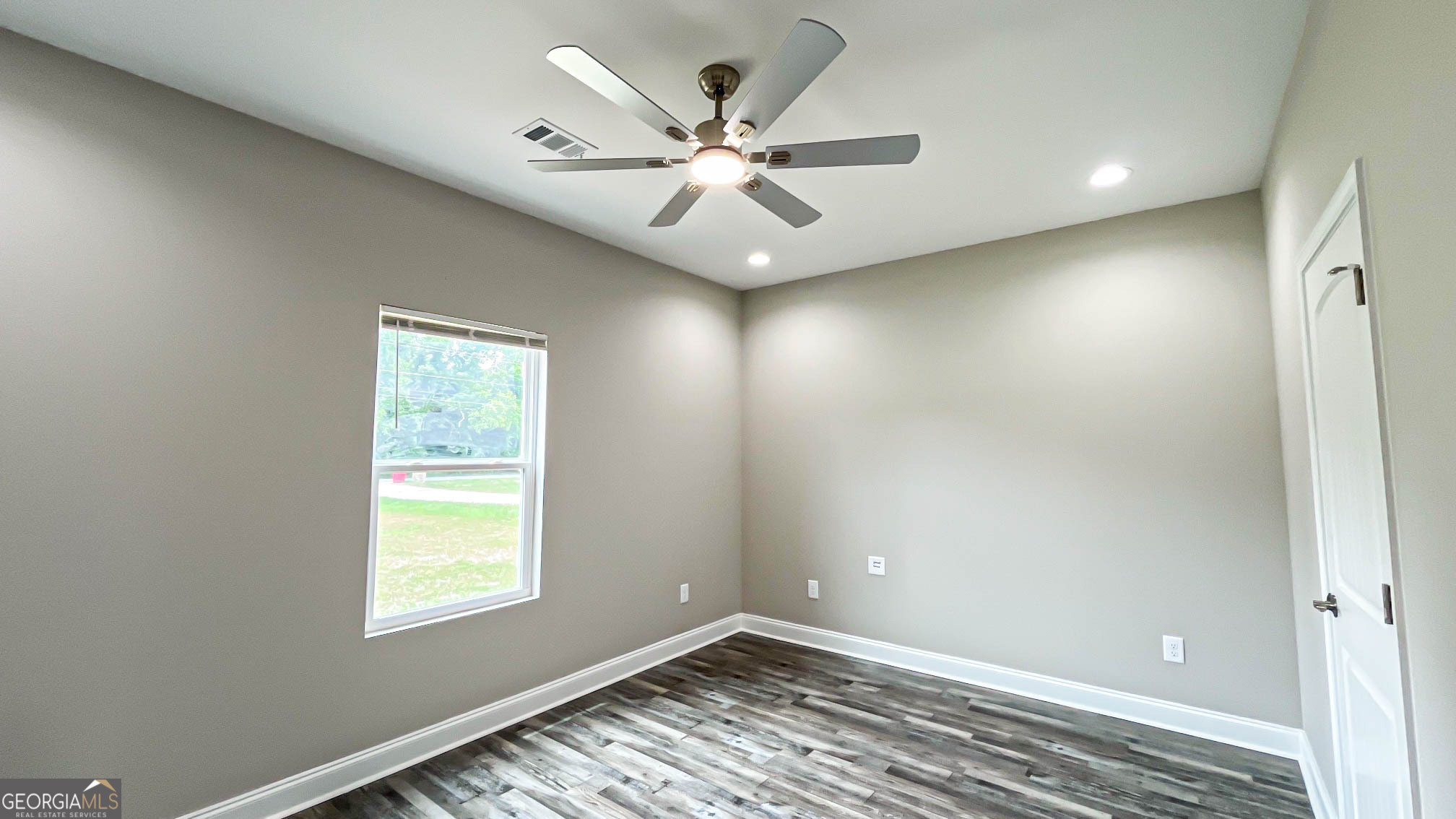 2011 Griffin Road Macon, GA 31216 - Photo 36 of 64 an empty room with fan and windows