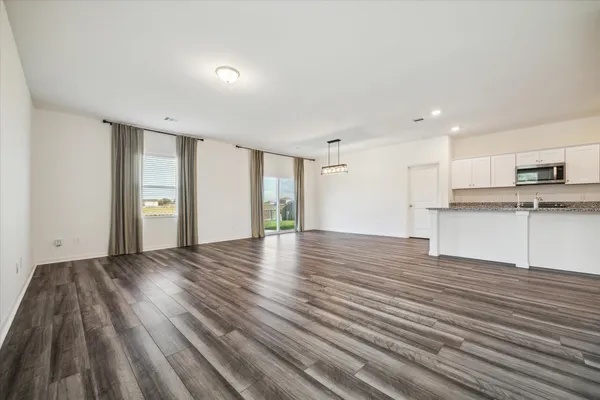 a kitchen with stainless steel appliances a refrigerator and a stove top oven
