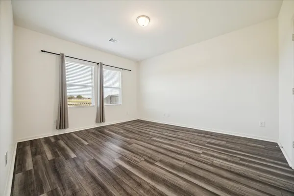 a spacious bathroom with a double vanity sink mirror and shower