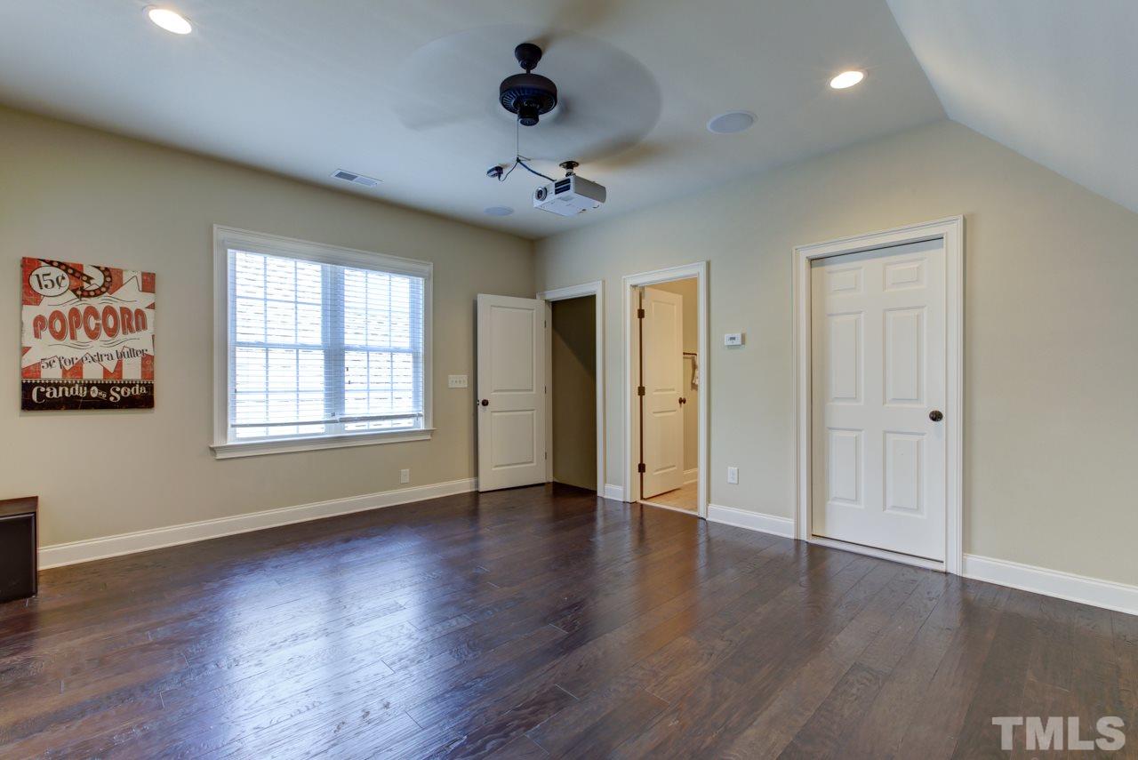 226 Penley Circle Raleigh, NC 27609 - Photo 11 of 14 a view of an empty room with wooden floor and a window