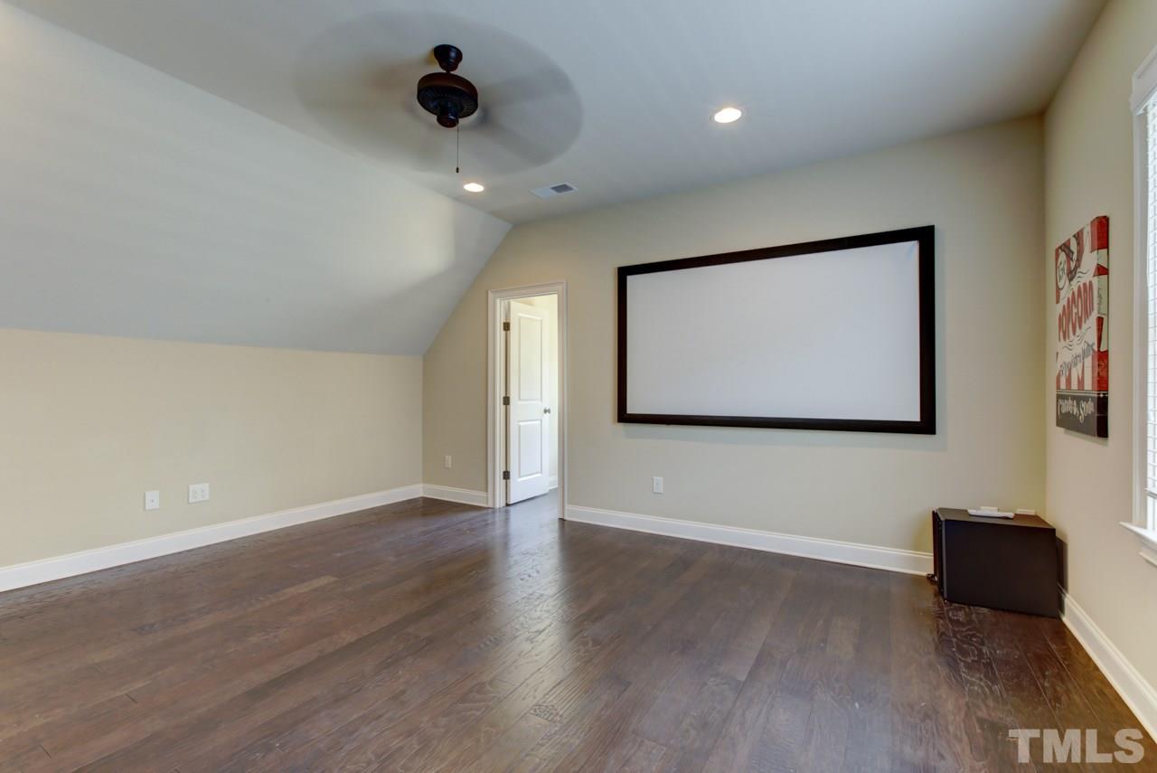 226 Penley Circle Raleigh, NC 27609 - Photo 12 of 14 a view of an empty room with wooden floor and a window