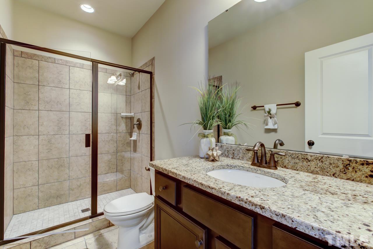 226 Penley Circle Raleigh, NC 27609 - Photo 13 of 14 a bathroom with a granite countertop sink toilet and shower