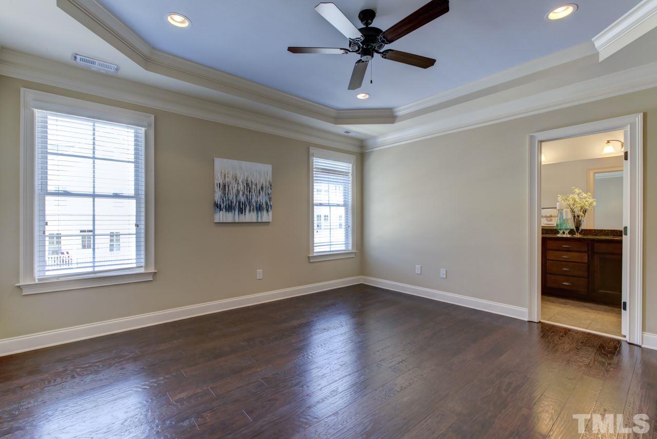 226 Penley Circle Raleigh, NC 27609 - Photo 9 of 14 a view of an empty room with window and wooden floor