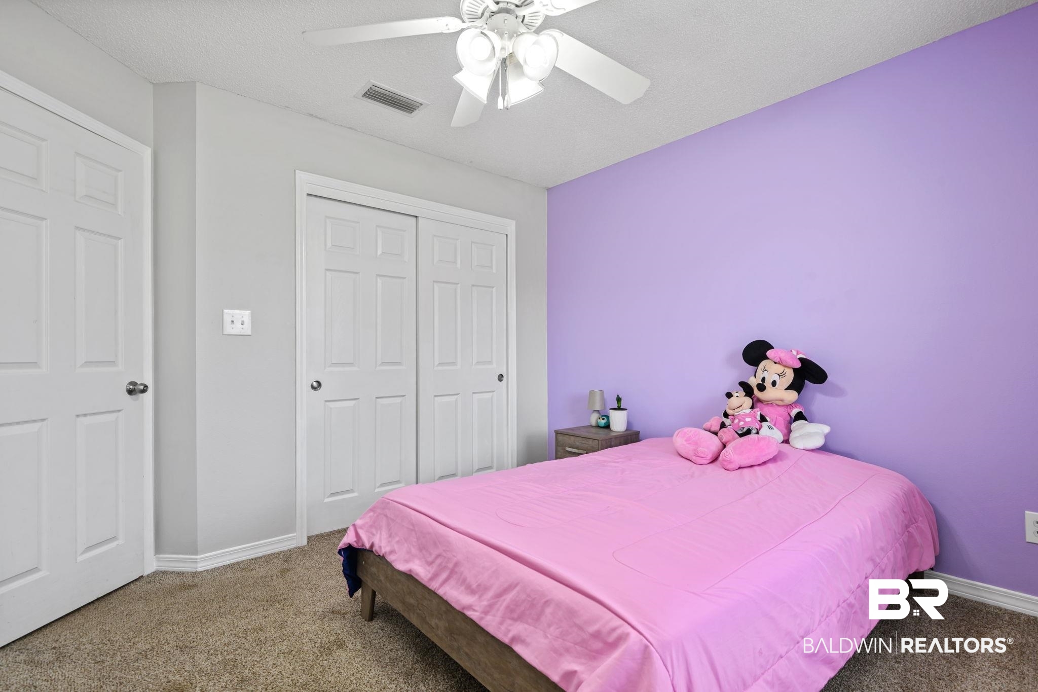 9422 Labrador Run South Mobile, AL 36695 - Photo 28 of 36 Carpeted room featuring a white ceiling fan with integrated lighting, a sliding closet with paneled doors, and a paneled entry door