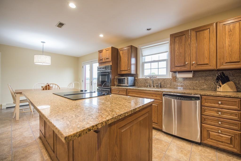 101 Plain Road Deerfield, MA 01373 - Photo 11 of 33 a kitchen with granite countertop a stove and a sink