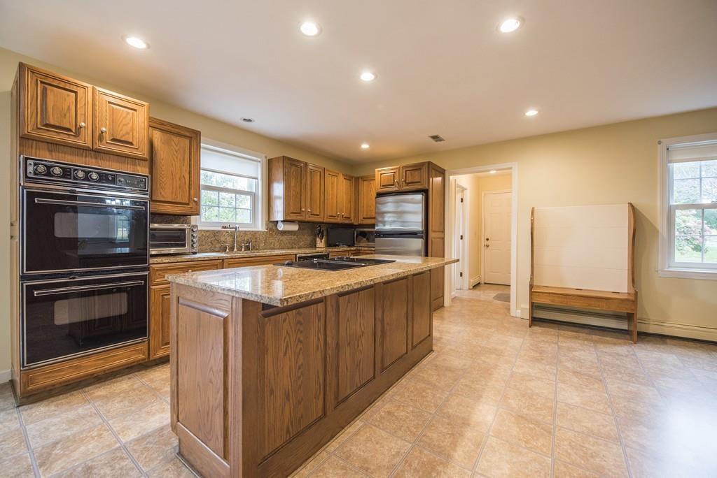 101 Plain Road Deerfield, MA 01373 - Photo 12 of 33 a kitchen with stainless steel appliances granite countertop a stove a sink and a refrigerator