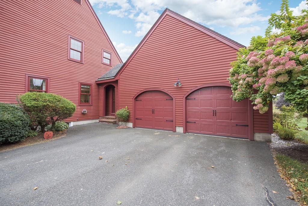 101 Plain Road Deerfield, MA 01373 - Photo 3 of 33 a front view of a house with a yard and garage