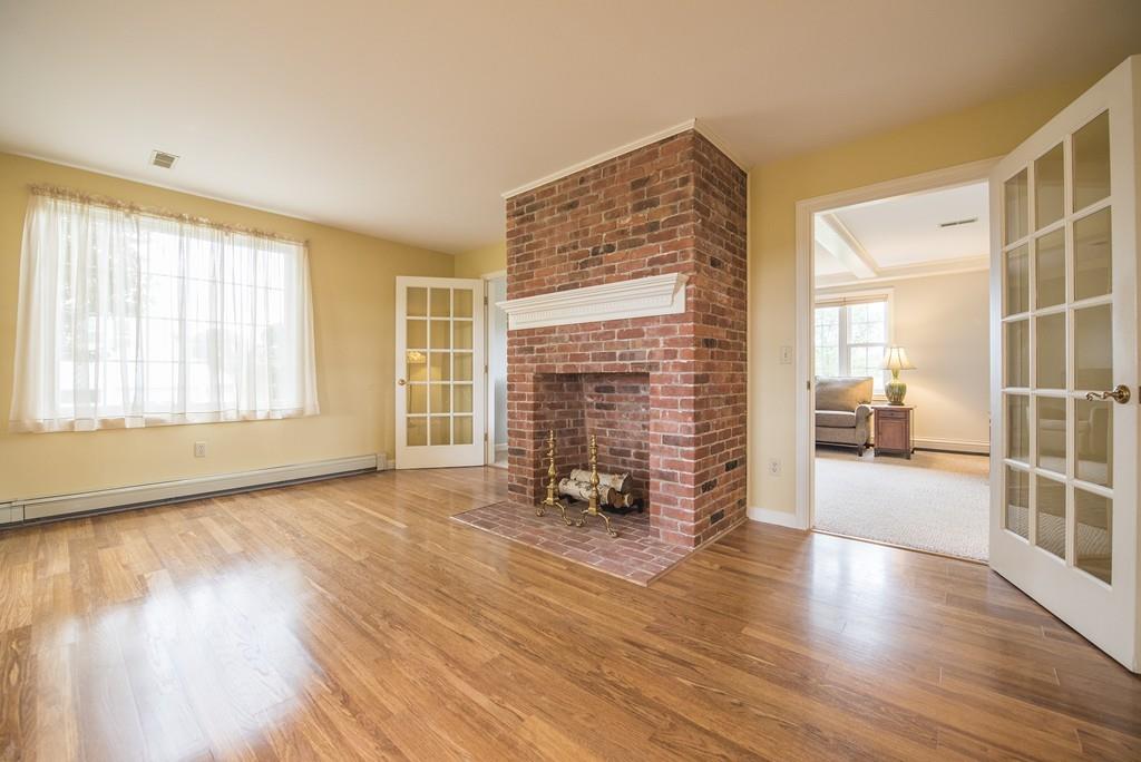 101 Plain Road Deerfield, MA 01373 - Photo 9 of 33 an empty room with wooden floor and windows