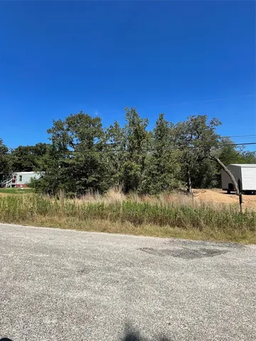 a view of lake with a yard