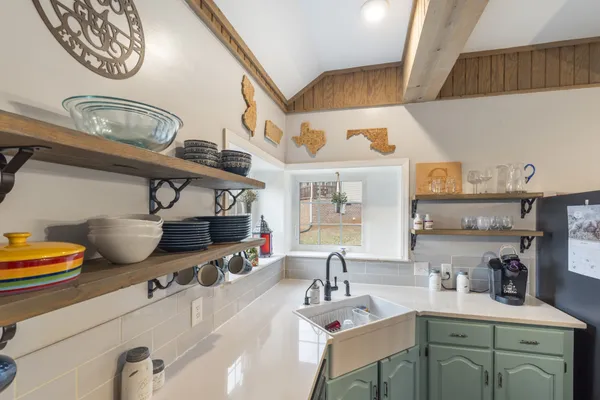 a kitchen with stainless steel appliances a sink and a stove