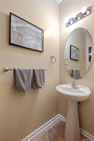 a bathroom with a sink and mirror