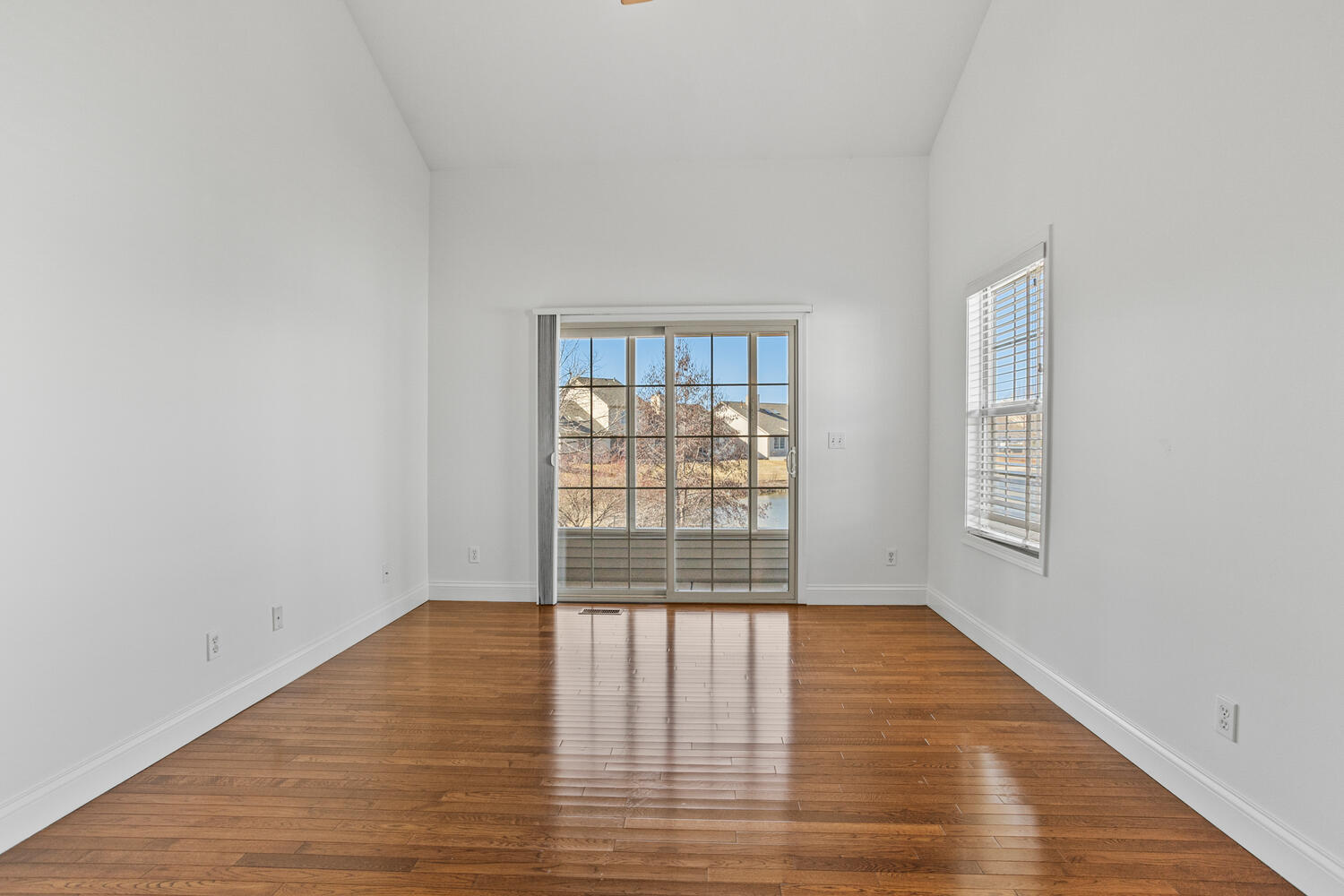 2517 Pembrook Point Champaign, IL 61821 - Photo 17 of 37 wooden floor in an empty room with a window