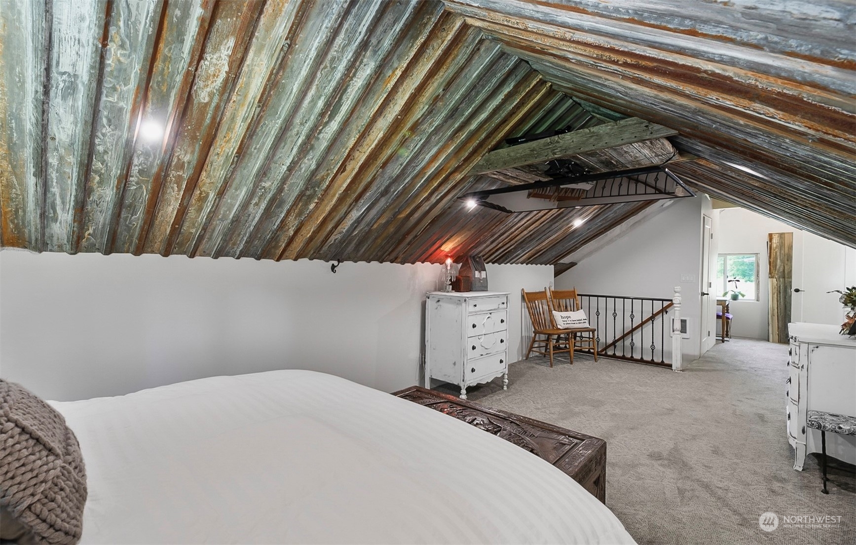 19829 Niederle Road Monroe, WA 98272 - Photo 20 of 39 a bedroom with a bed and a chandelier