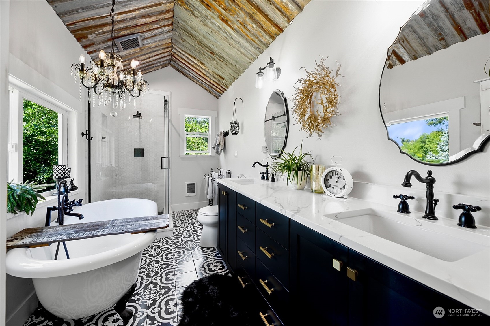 19829 Niederle Road Monroe, WA 98272 - Photo 22 of 39 a spacious bathroom with a double vanity sink a mirror and a bathtub
