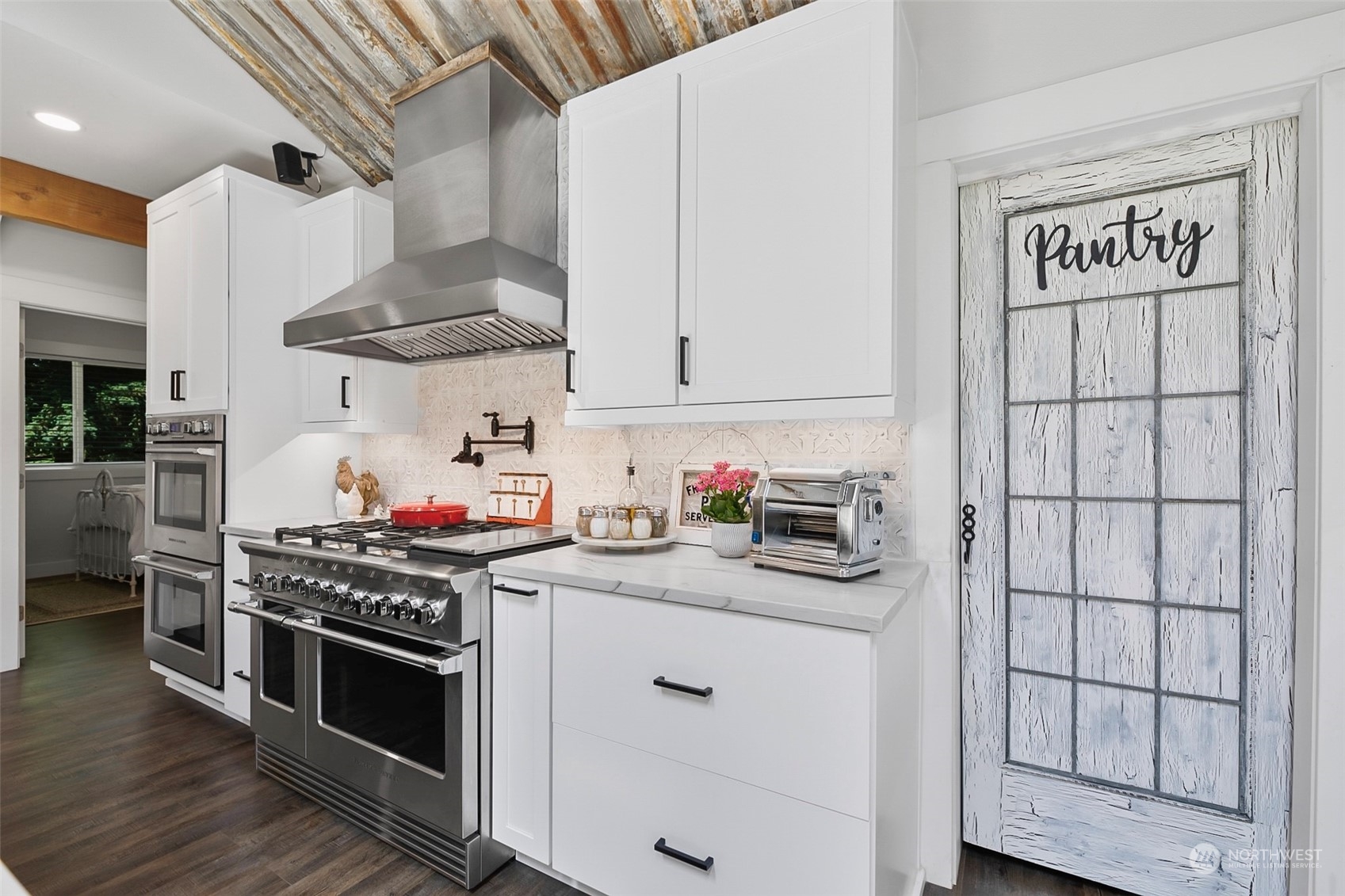19829 Niederle Road Monroe, WA 98272 - Photo 8 of 39 a kitchen with stainless steel appliances a stove a sink and cabinets
