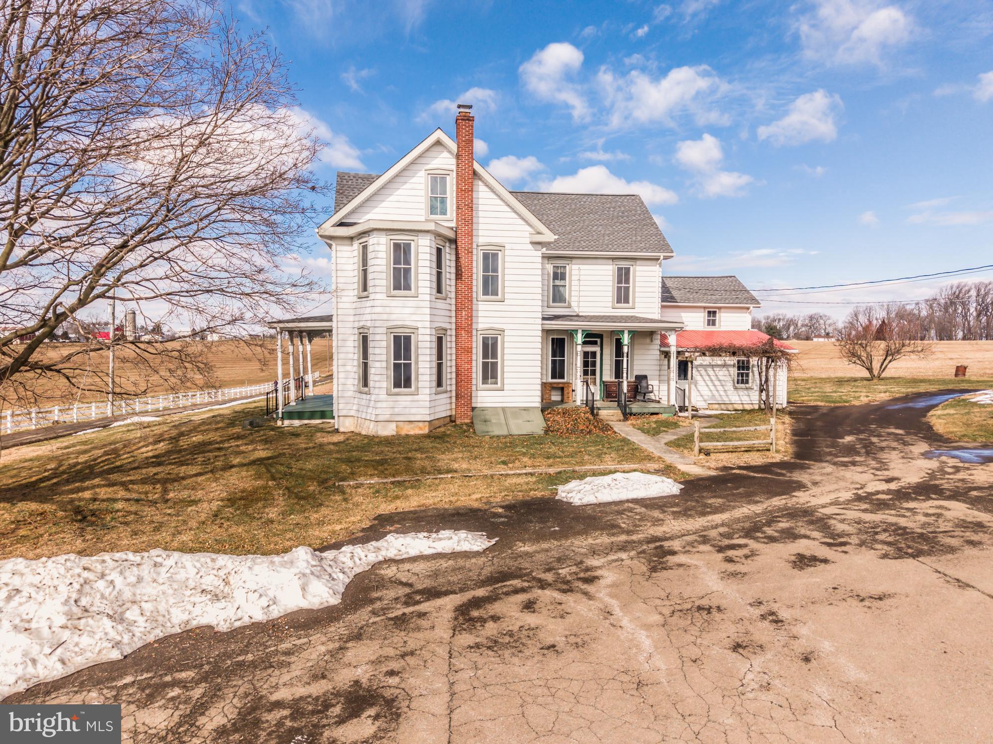 397 Jackson Road Quarryville, PA 17566 - Photo 25 of 41 a view of a large white house with a snow on the road