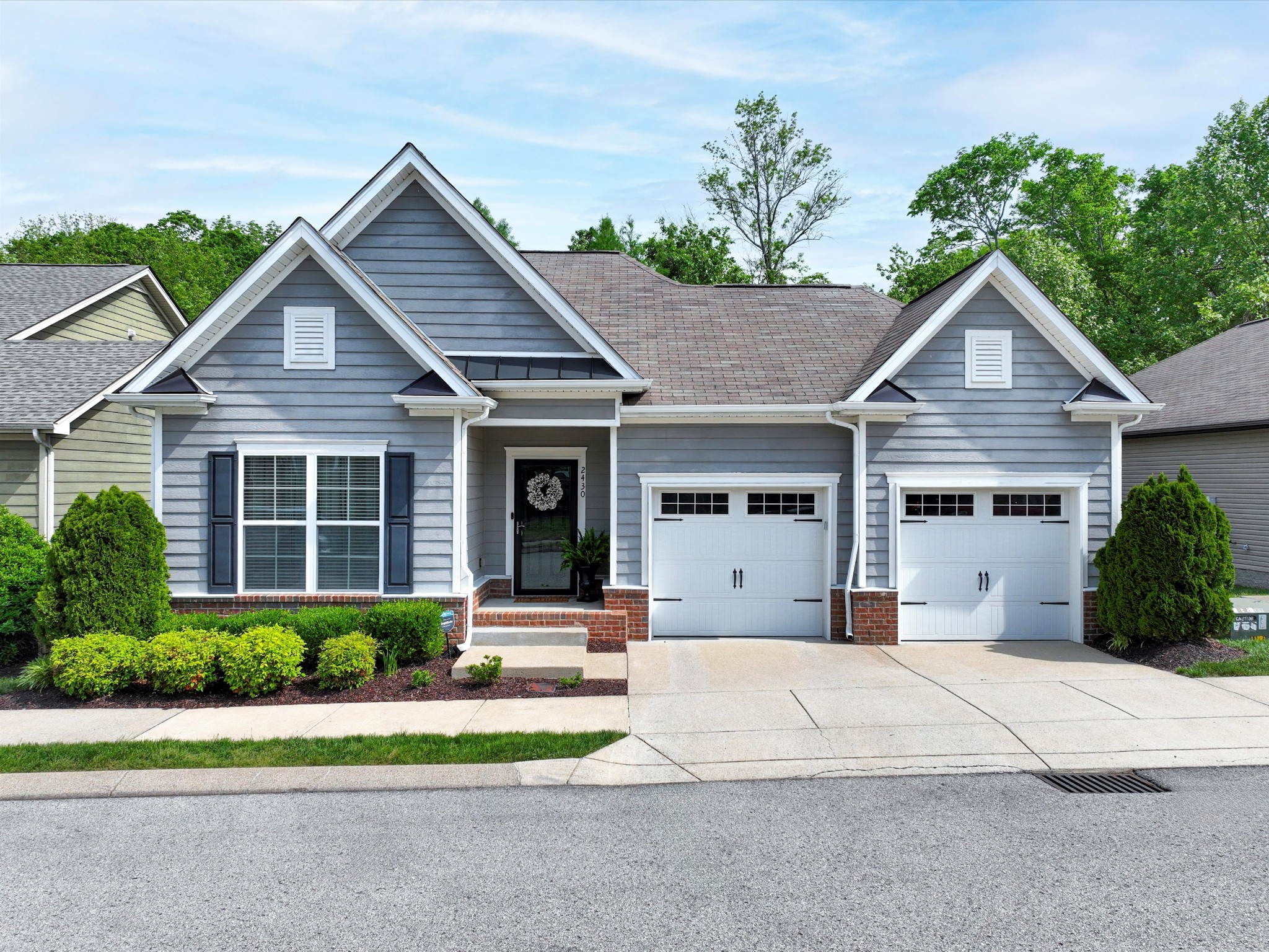 2430 Duxbury Drive Columbia, TN 38401 - Photo 1 of 48 a front view of a house with a yard and potted plants