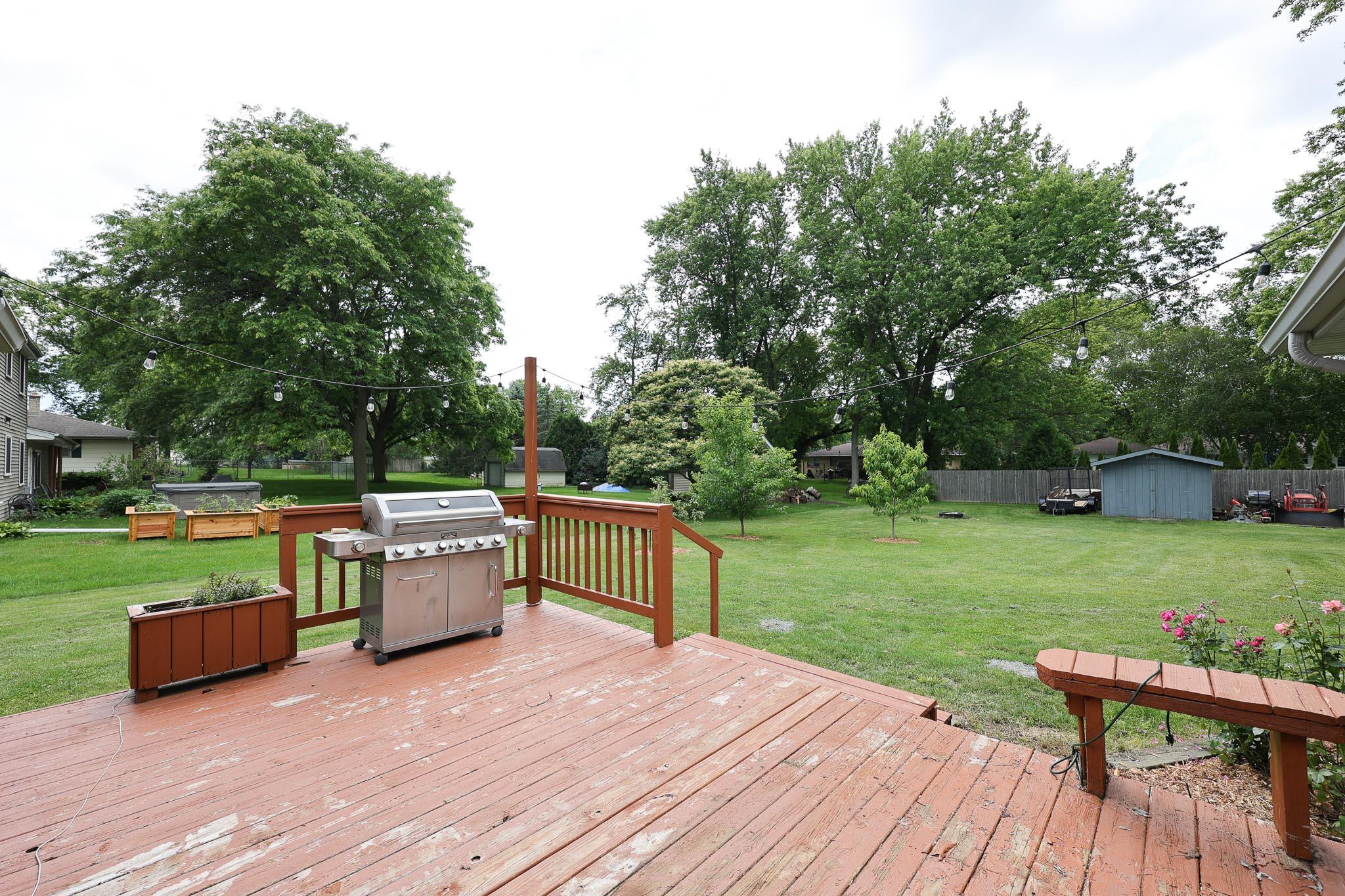 1408 South Emmertsen Road Mount Pleasant, WI 53406 - Photo 26 of 32 Look at the huge yard. Very nice size deck as well.
